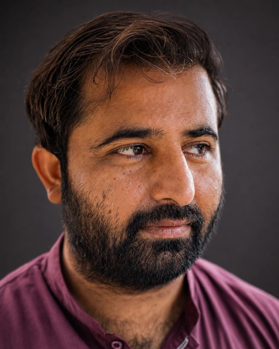 Close studio portrait with quiet directional light